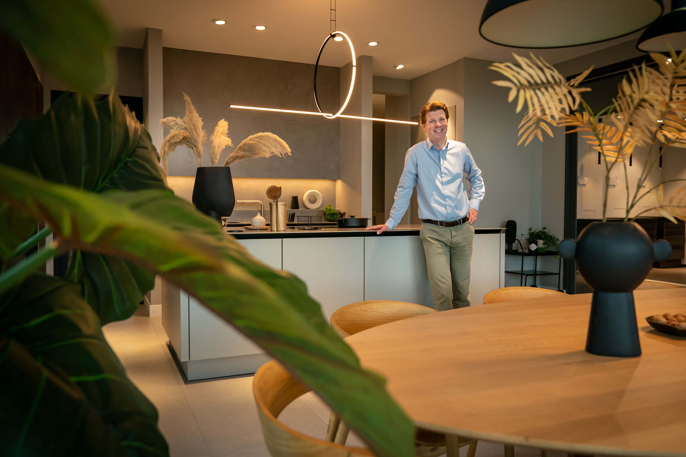 DHOMUS CEO standing in a kitchen showroom